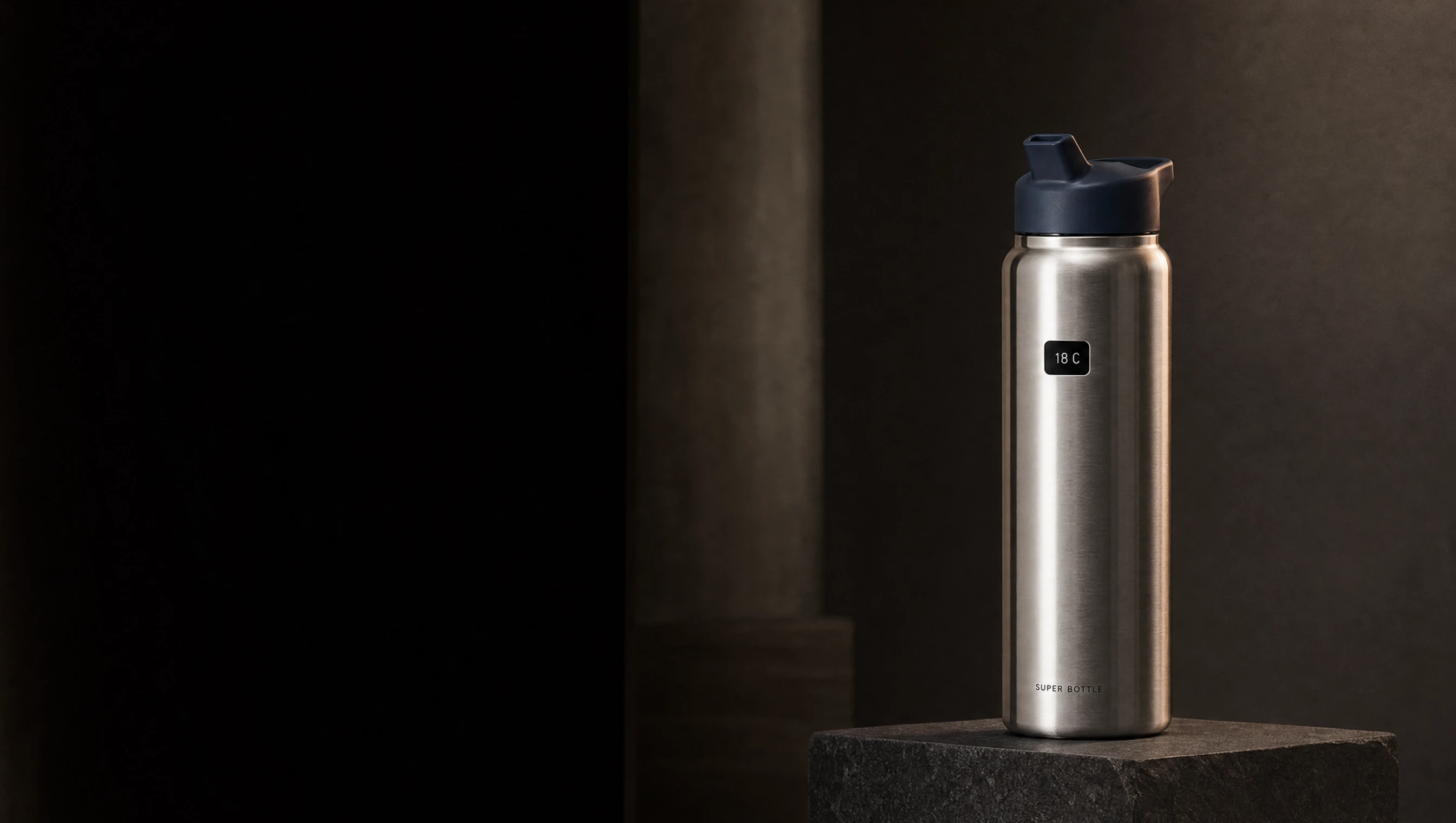 Super Bottle stainless steel design concept on a dark stone plinth